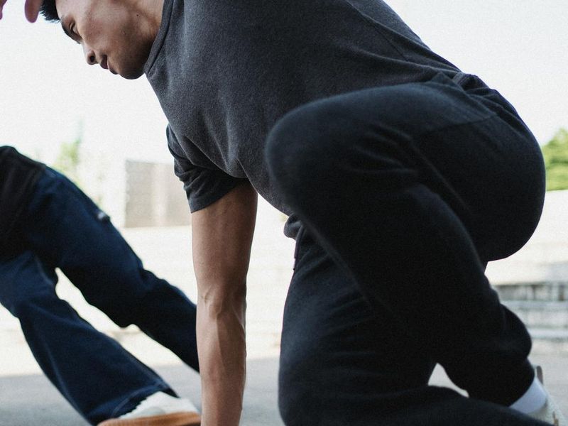 Athlete in motion showing dynamic body flow.